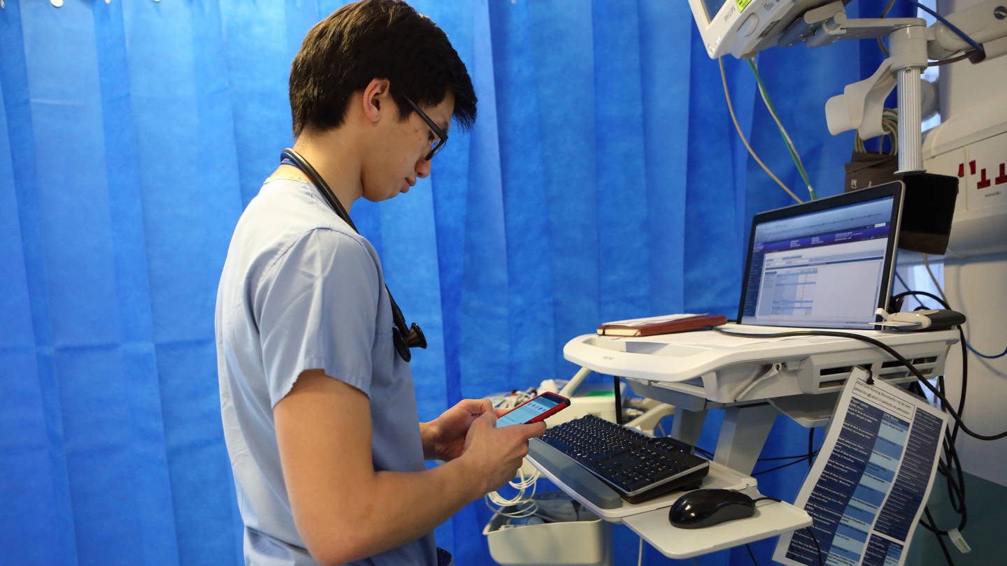 junior doctor looking at a computer