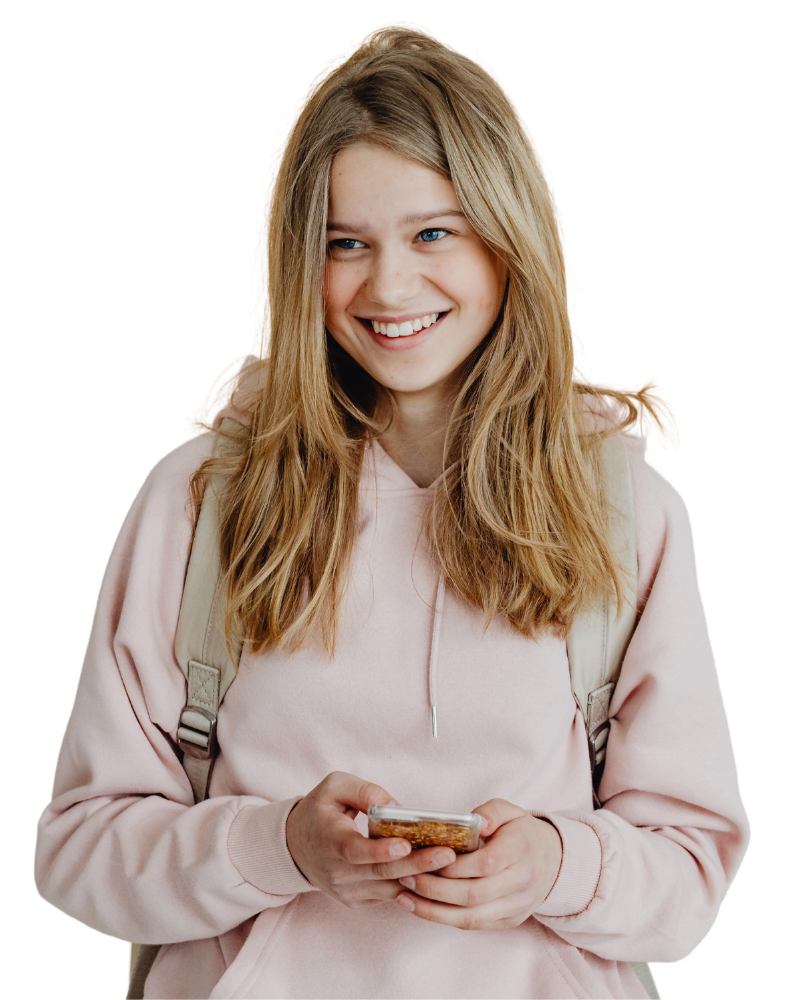 girl in pink hoodie smiling to the side while on phone