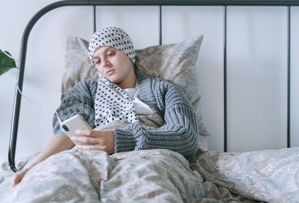 A cancer patient lying in bed 