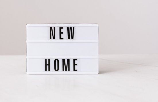 Image of a sign saying new home