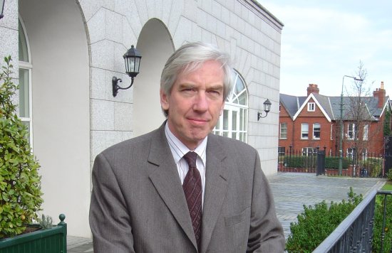 Male with grey hair in suit