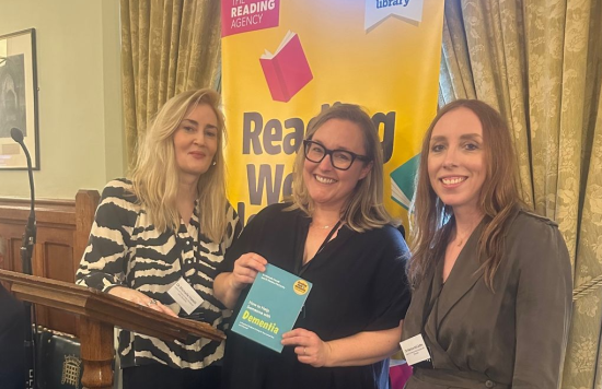 Dr Michelle Hamill and Dr Martina McCarthy posing with their book at an event in the House of Commons.