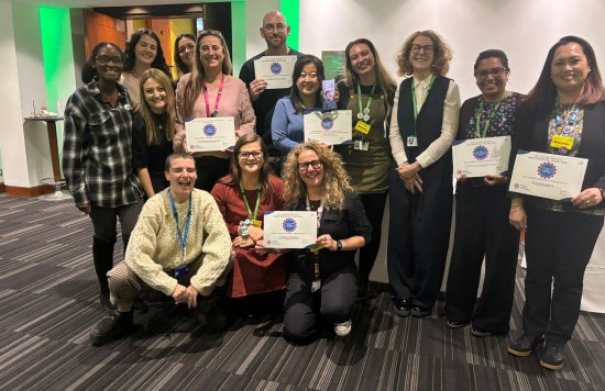 AHP award winners pictured in a group holding up their certificates 