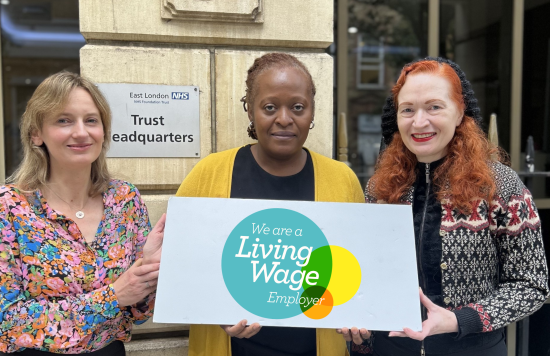 Left to right: Director of Population Health, Laura Austin Croft, ELFT Chief Executive, Lorraine Sunduza OBE and People Participation Cost of Living Lead, Susan Downing holding a living wage plaque. 